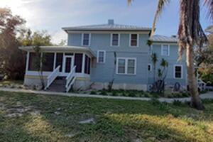 Vinyl Window Sunroom on Wrap Around Porch in Merritt Island