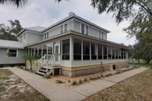 Vinyl Window Sunroom on Wrap Around Porch in Merritt Island